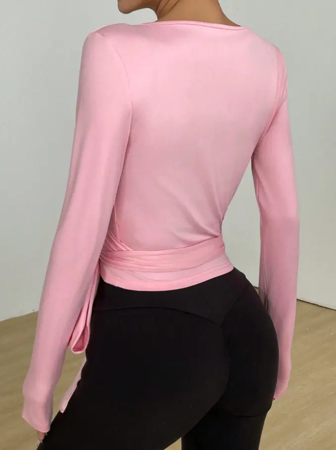 Pink women's wrap long sleeve active top, back view